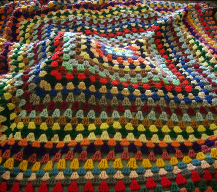 photo of colorful crocheted afghan