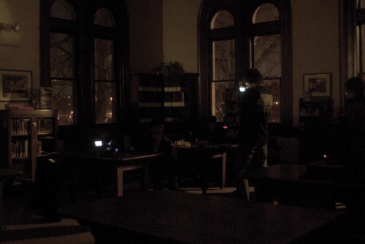 photo of people filming in the dark