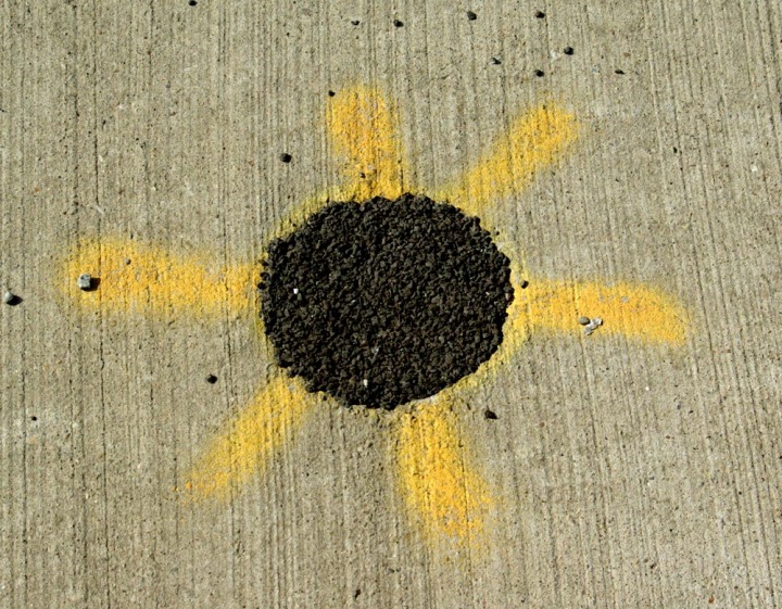 tar and spraypaint on sidewalk