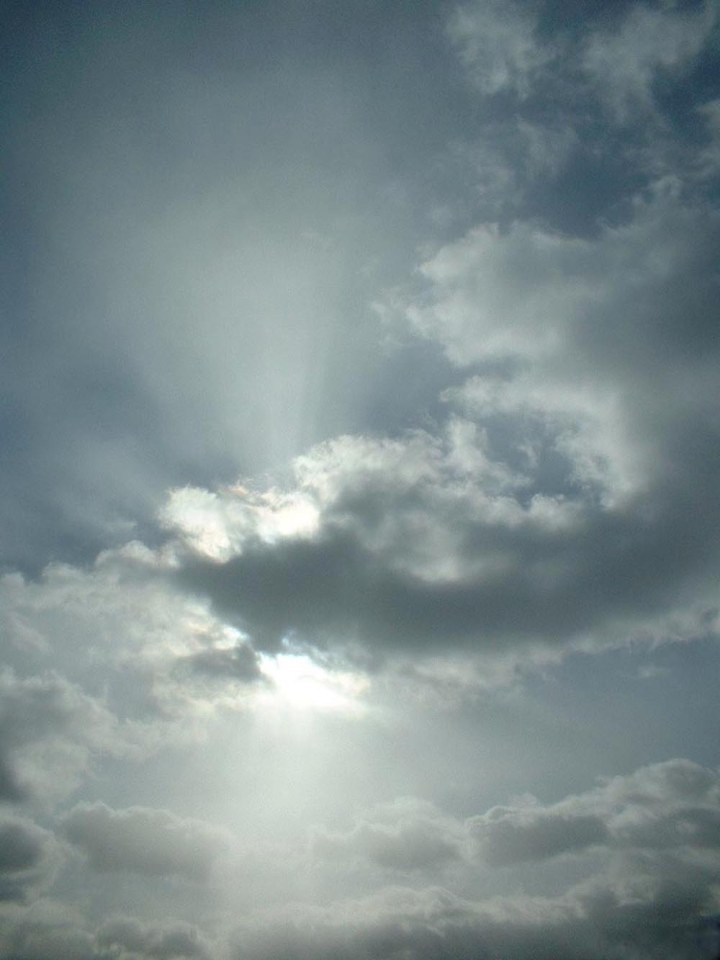 sun shining from behind cloud