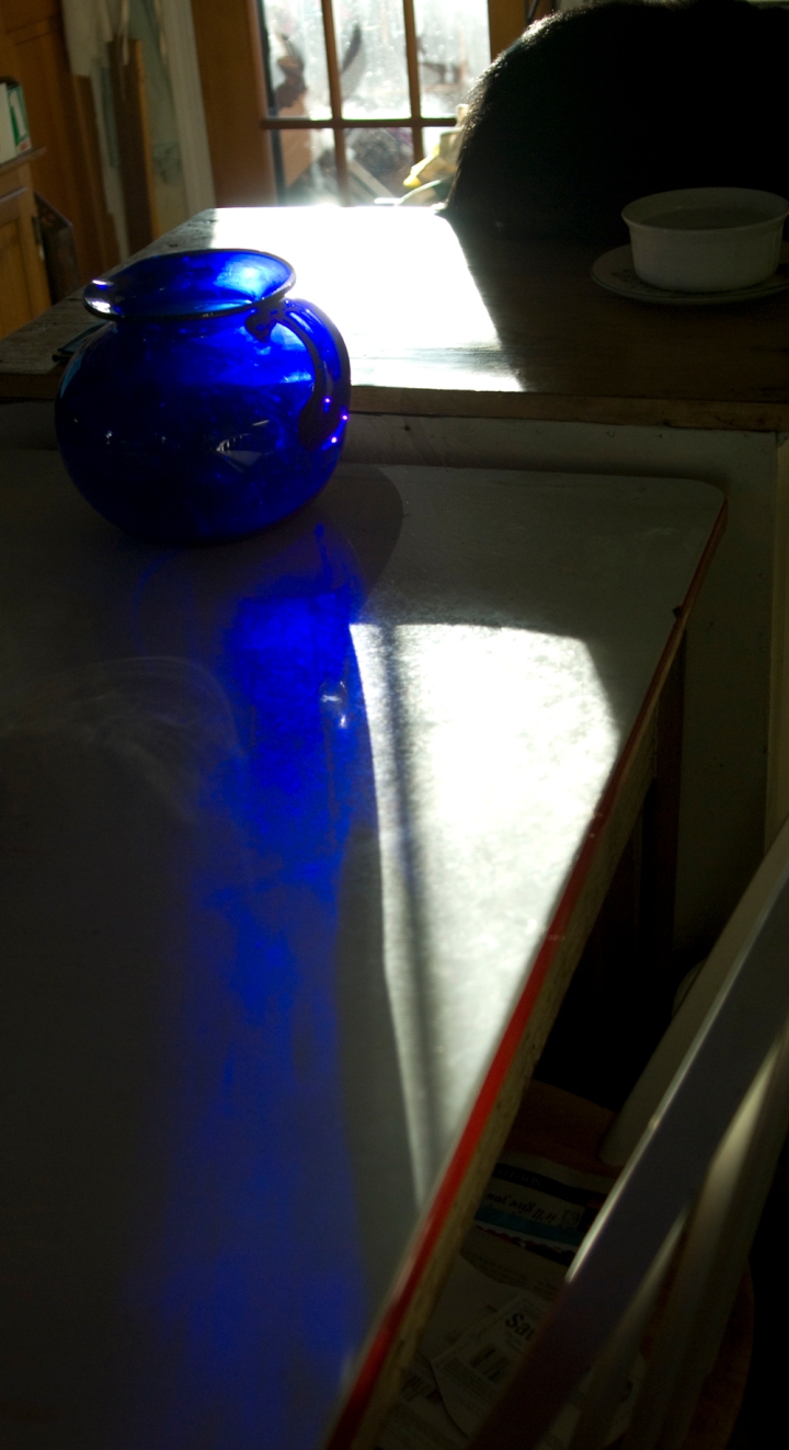 morning sun through blue pitcher