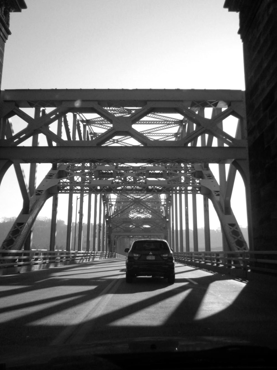 car crossing onto bridge