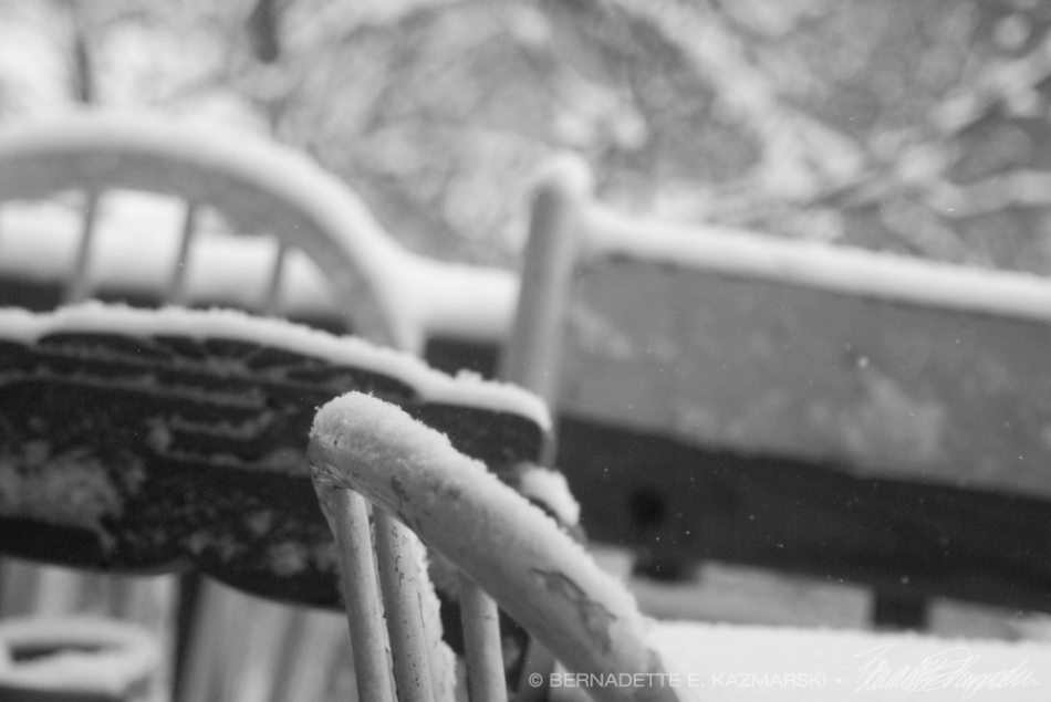 wooden chairs with snow