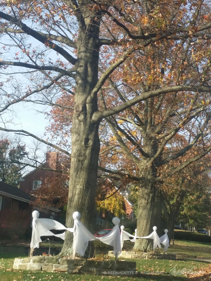 ghosts dance around tree